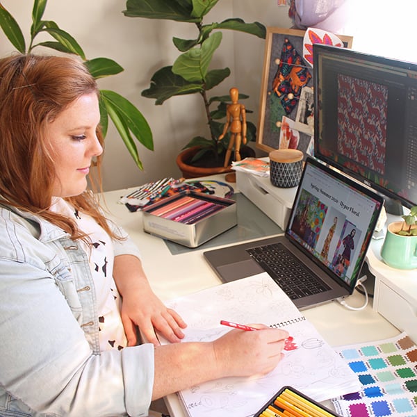 Crystal Kruger sketching designs in her studio